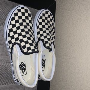 Vans slip ons checkered style. Brand new .shoe size for men 9.5